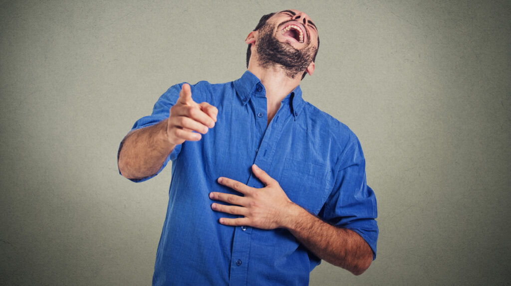 Laughing young man. (c) AdobeStock