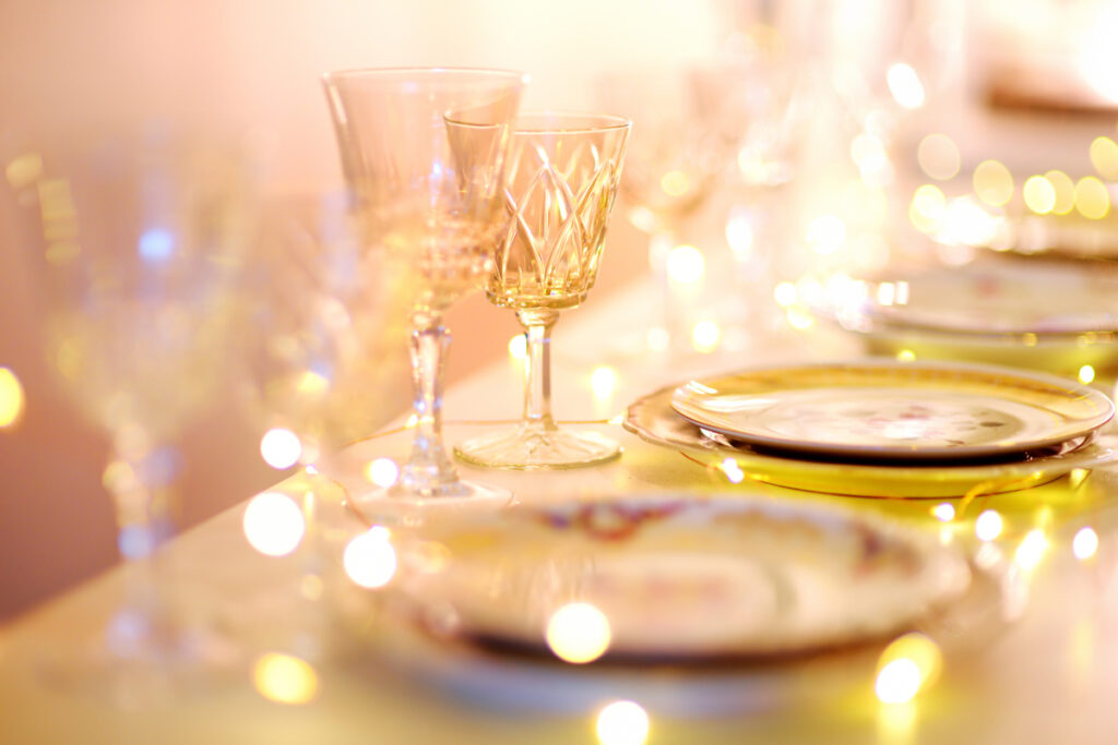 Table set for an event party or wedding reception in orange light (c) AdobeStock