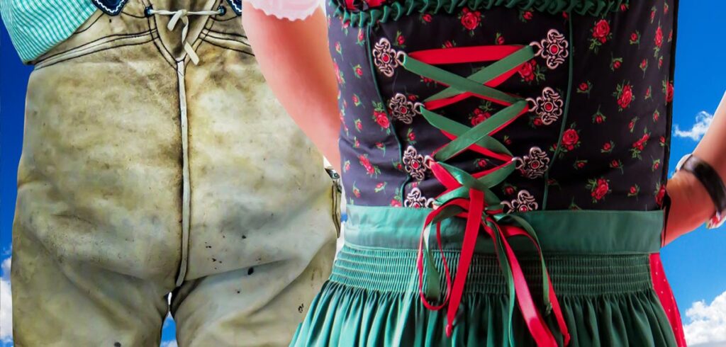 Ausschnitt einer Frau in Dirndl und eines Mannes in Lederhose. (c) Image by G.C. from Pixabay